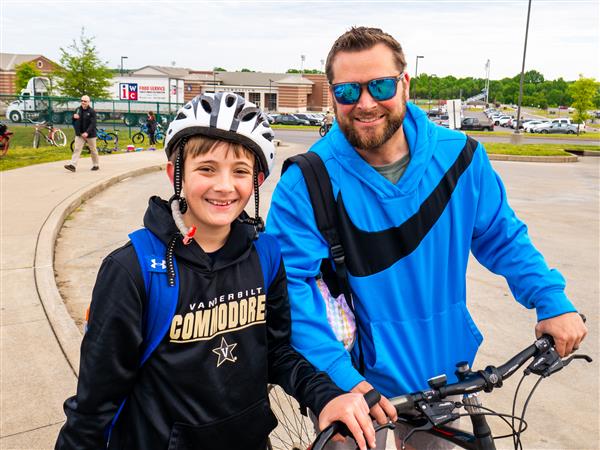 Students bike to school in the morning.